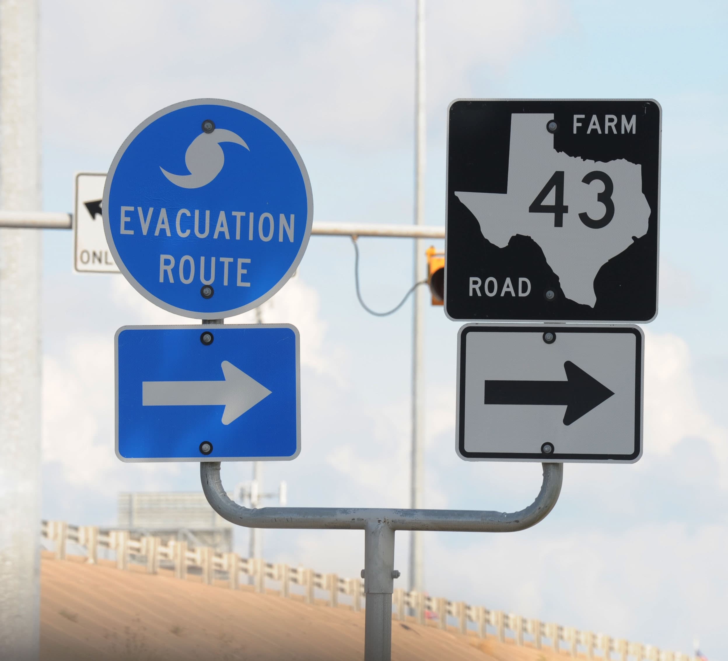 Hurricane evacuation route sign explaining when a hurricane watch vs warning may require leaving early