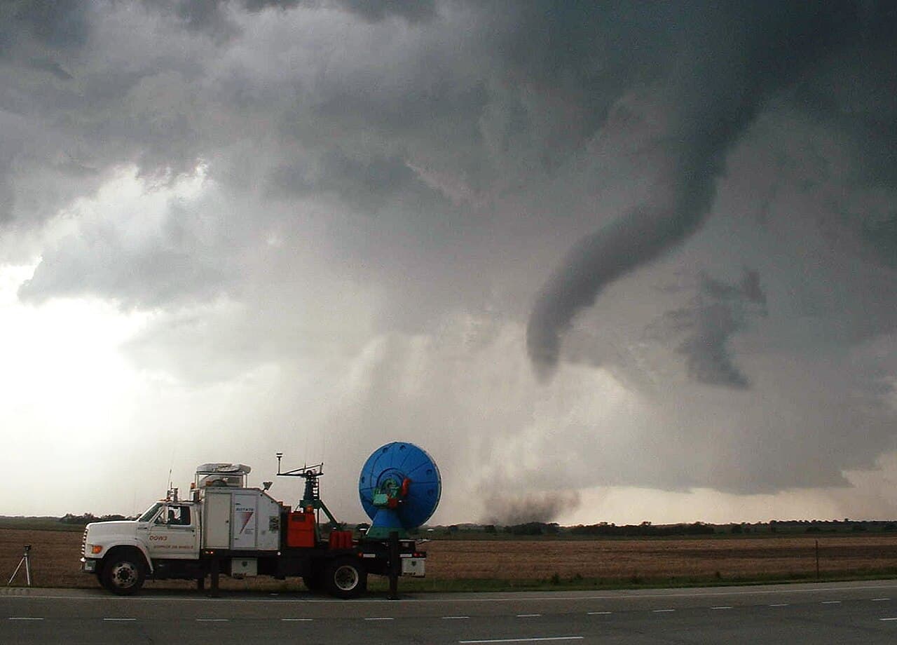 Tornado near a Doppler on Wheels truck during a tornado watch vs warning setup