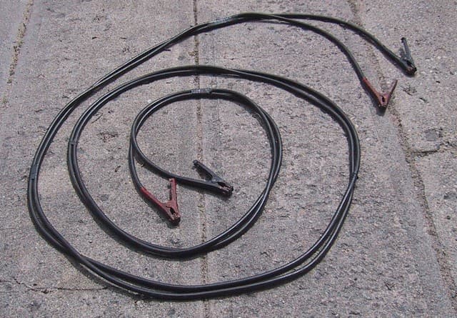 Jumper cables packed as a key item in a winter emergency car kit